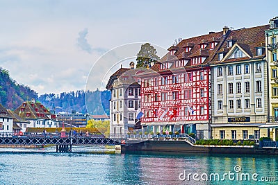 Spectacular medieval houses on bank of Reuss river, on March 30 in Lucerne, Switzerland Editorial Stock Photo