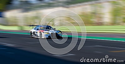 Spectacular scenic racing car on asphalt racetrack BMW M4 blurred motion background Editorial Stock Photo
