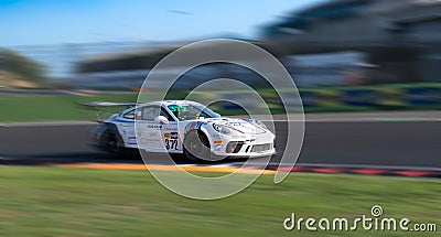 Spectacular scenic racing car on asphalt racetrack Porsche 911 blurred motion background Editorial Stock Photo