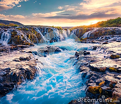 Spectacular summer view of Bruarfoss Waterfall, secluded spot with cascading blue waters. Superb sunrise in Iceland, Europe. Stock Photo