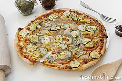 spectacular thin crust pizza with vegetable ingredients for people with vegan lifestyle on white table Stock Photo