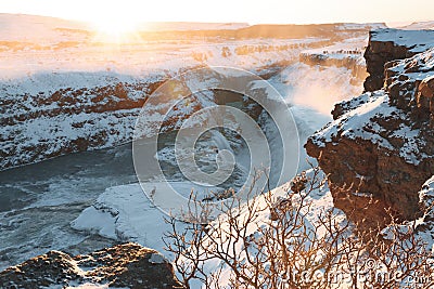 spectacular view of beautiful Gullfoss waterfall and snow-covered rocks Stock Photo