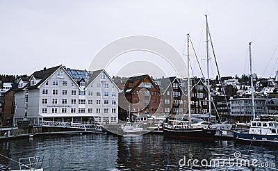 Spectacular view of boats and houses in the port of Tromso in winter, Norway. Editorial Stock Photo