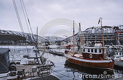 Spectacular view of boats and houses in the port of Tromso in winter, Norway. Editorial Stock Photo