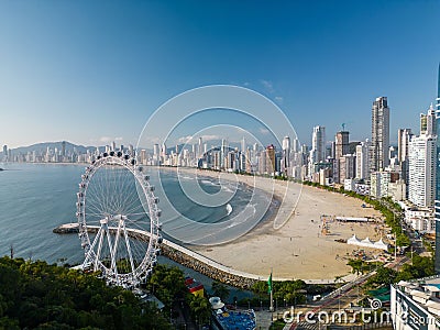 Spectacular view of a huge paddle wheel on Balneario Camboriu city beach Editorial Stock Photo