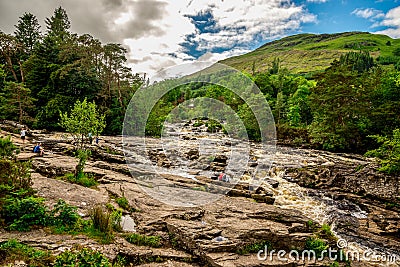 A spectacular view to Falls of Dochart from the bridge in Killin, Scotland Editorial Stock Photo