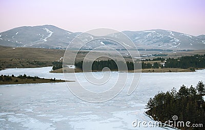 Spectacular winter landscape of fields and mountains Stock Photo