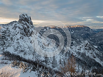 Spectacular winter mountain landscape illuminated by setting sun. Stock Photo