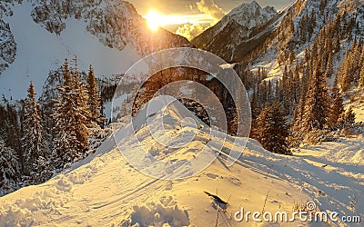 Spectacular winter mountain landscape illuminated by setting sun. Stock Photo