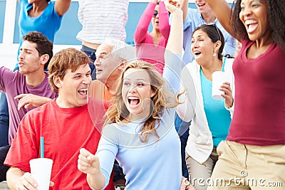 Spectators Celebrating At Outdoor Sports Event Stock Photo