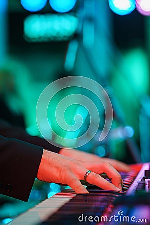 Speech by musicians on stage. Hands and musical instrument closeup. Stock Photo