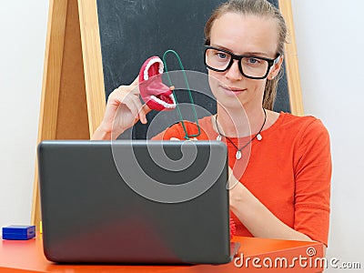 Speech Therapist conducts an online lesson with a laptop Stock Photo