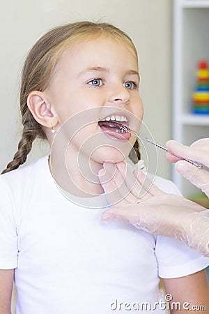 Speech therapist teaches the girl Stock Photo