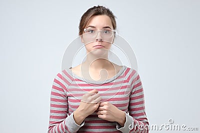 Speechless woman with arms down for disillusion Stock Photo