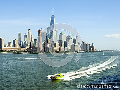 Speed Boat on the Hudson River Against New York City Skyline Editorial Stock Photo