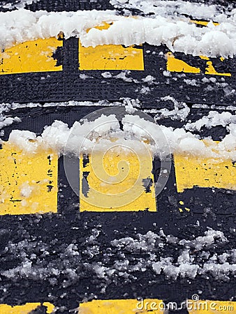 Speed bump obstacle covered with snow. Stock Photo