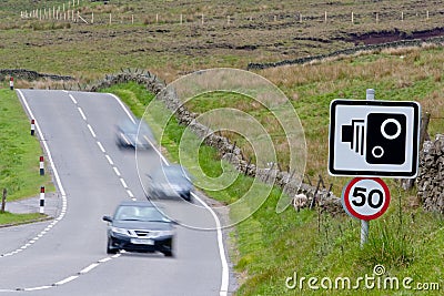 Speed camera with speeding cars Stock Photo