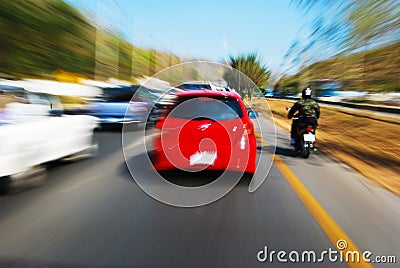 Speed drive following red car Stock Photo