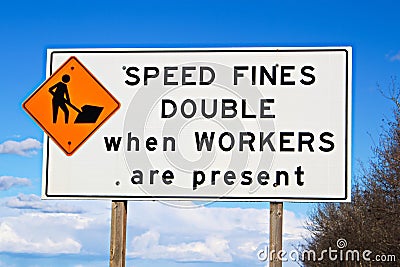 Speed fines double sign along highway Stock Photo