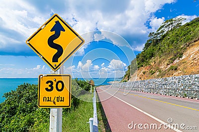Speed limit signs of 30 km / hour and beware meander sign Stock Photo