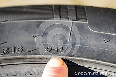 The speed and load index markings on the sidewall of the tire Stock Photo