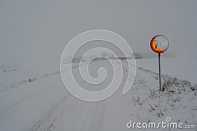 speed sign with 70 kph covered in snow Stock Photo