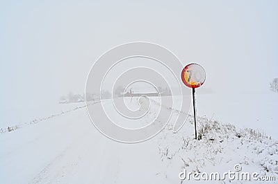 speed sign with 70 kph covered in snow Stock Photo