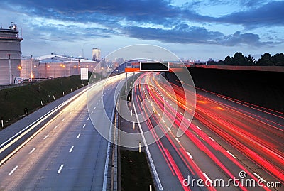 Speed Traffic at Dramatic Sundown Time - light trails on motorwa Stock Photo