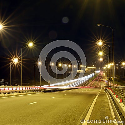 Speed Traffic at Dramatic Sundown Time - light trails on motorway highway at night, long exposure abstract urban background Stock Photo