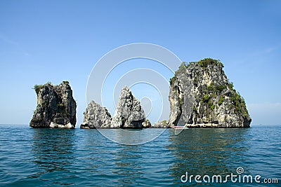 Speedboat and limestone outcrops, Krabi, Thailand Stock Photo