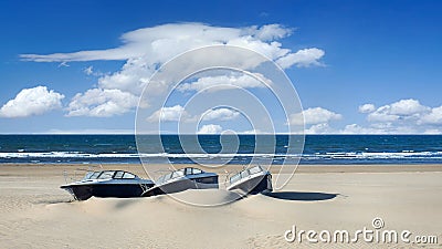 Speedboats on an abandoned sunny tropical beach Stock Photo