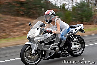 Speeding Motorcycle Woman Stock Photo