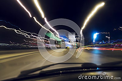 Speeding on the road at night Stock Photo