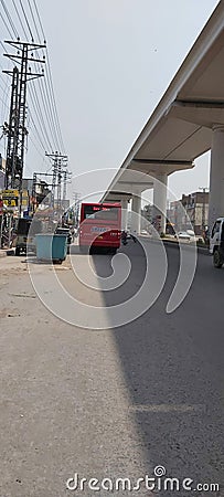 speedo bus service and orange train track in Lahore Pakistan. Editorial Stock Photo