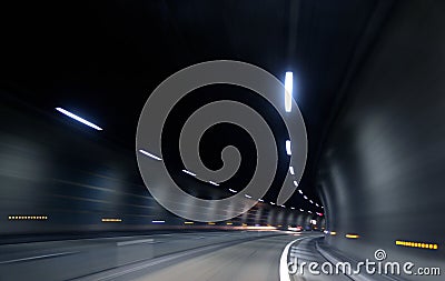 Speedy fast motion in dark tunnel Stock Photo