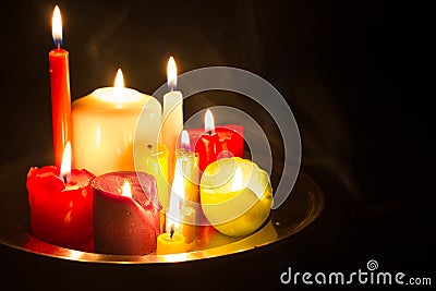 Spells omens and magic abstract background with candles in night Stock Photo