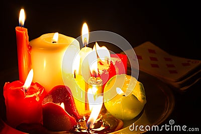 Spells omens and magic abstract background with candles in night Stock Photo