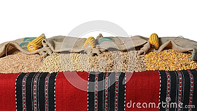 Spelt, soybean, wheat grains and corn kernels in jute sacks. Stock Photo