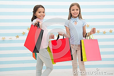 Spending great time together. Children satisfied shopping striped background. Obsessed with shopping and clothing malls Stock Photo