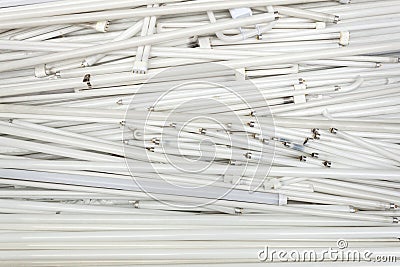 Spent old flourescent lamp tubes about to be recycled Stock Photo