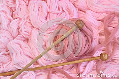 Sphere of pink wool with needles Stock Photo