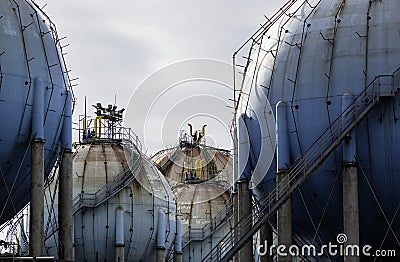 Spherical Natural Gas Tank in the Petrochemical Industry in daylight, Gijon, Asturias, Spain Stock Photo