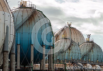 Spherical Natural Gas Tank in the Petrochemical Industry in daylight, Gijon, Asturias, Spain Stock Photo