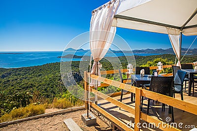 Spiaggia di Rena Bianca beach with red rocks and azure clear water. Costa Smeralda, Sardinia, Italy Stock Photo