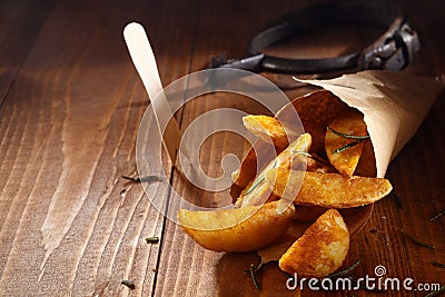 Spiced golden potato wedges Stock Photo