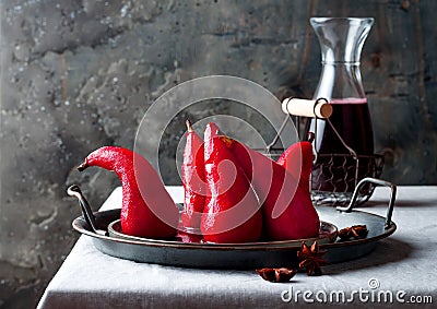 Spiced hibiscus or red wine poached pears. Delicious winter french dessert. Stock Photo