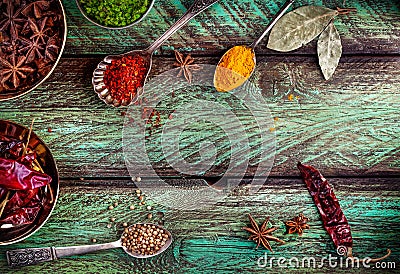 Spices at the green table Stock Photo