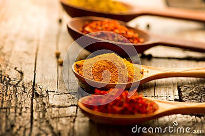 Spices and herbs over wooden background Stock Photo