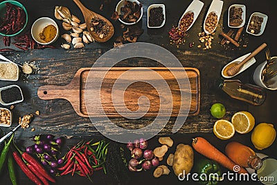 Spices for use as cooking ingredients on a wooden background with Fresh organic vegetables on wood. Healthy food herbs and spices Stock Photo