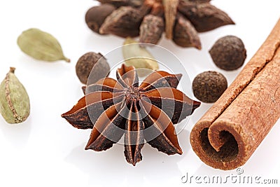 Spices for winter dishes isolated on white background . Mulled wine or ingredients for seasonal Christmas baking are aromatic Stock Photo